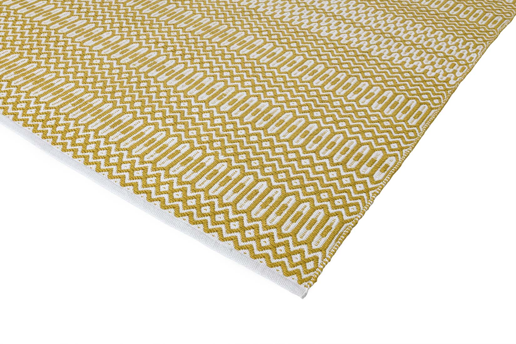 yellow indoor/outdoor rug with geometric design

