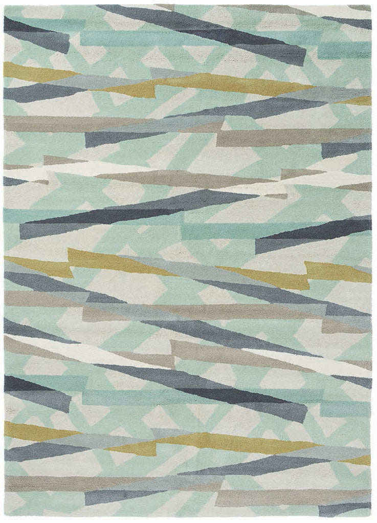 mint green wool rug with abstract design in mustard, grey and taupe