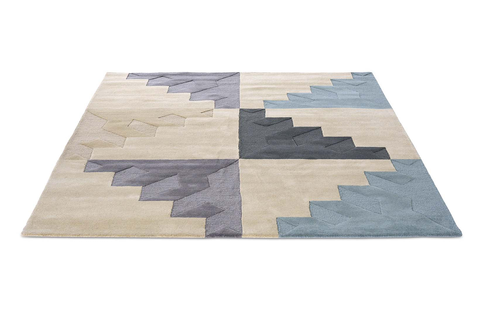 Geometric rug in shades of beige, grey, and navy