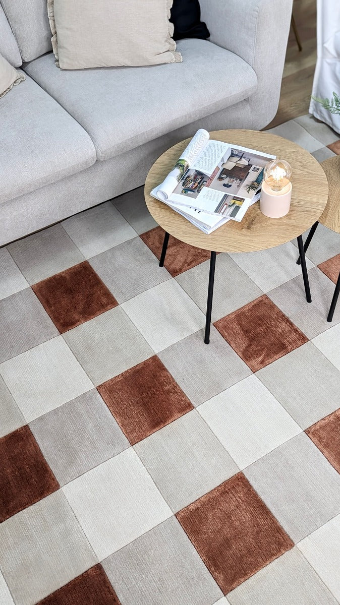 cream and copper rug with geometric pattern