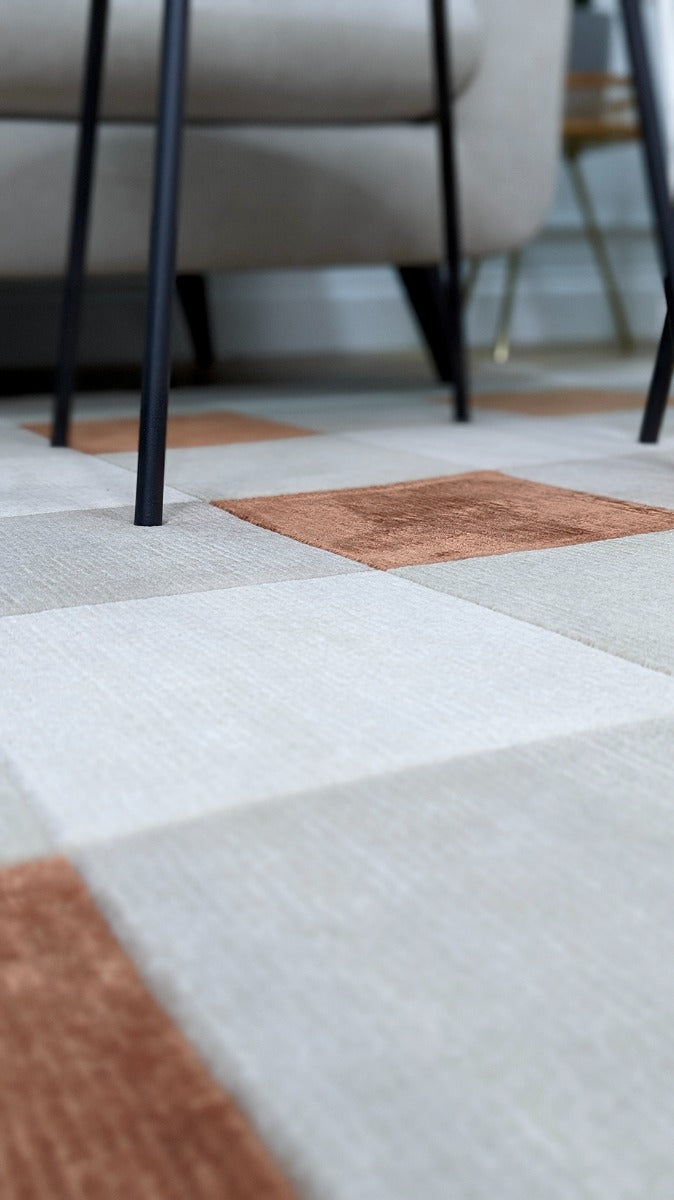 cream and copper rug with geometric pattern