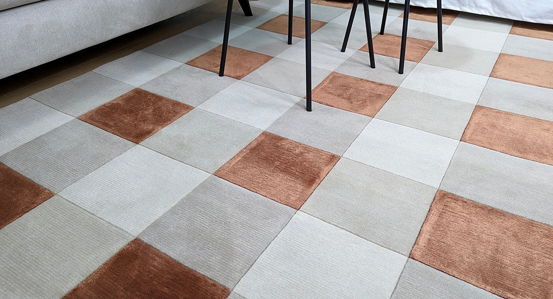 cream and copper rug with geometric pattern