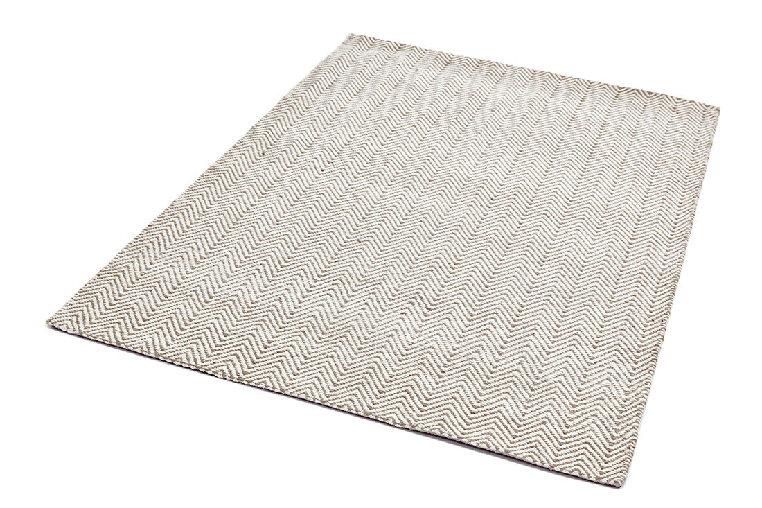 Neutral rug with chevron design