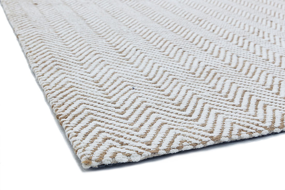 Neutral rug with chevron design