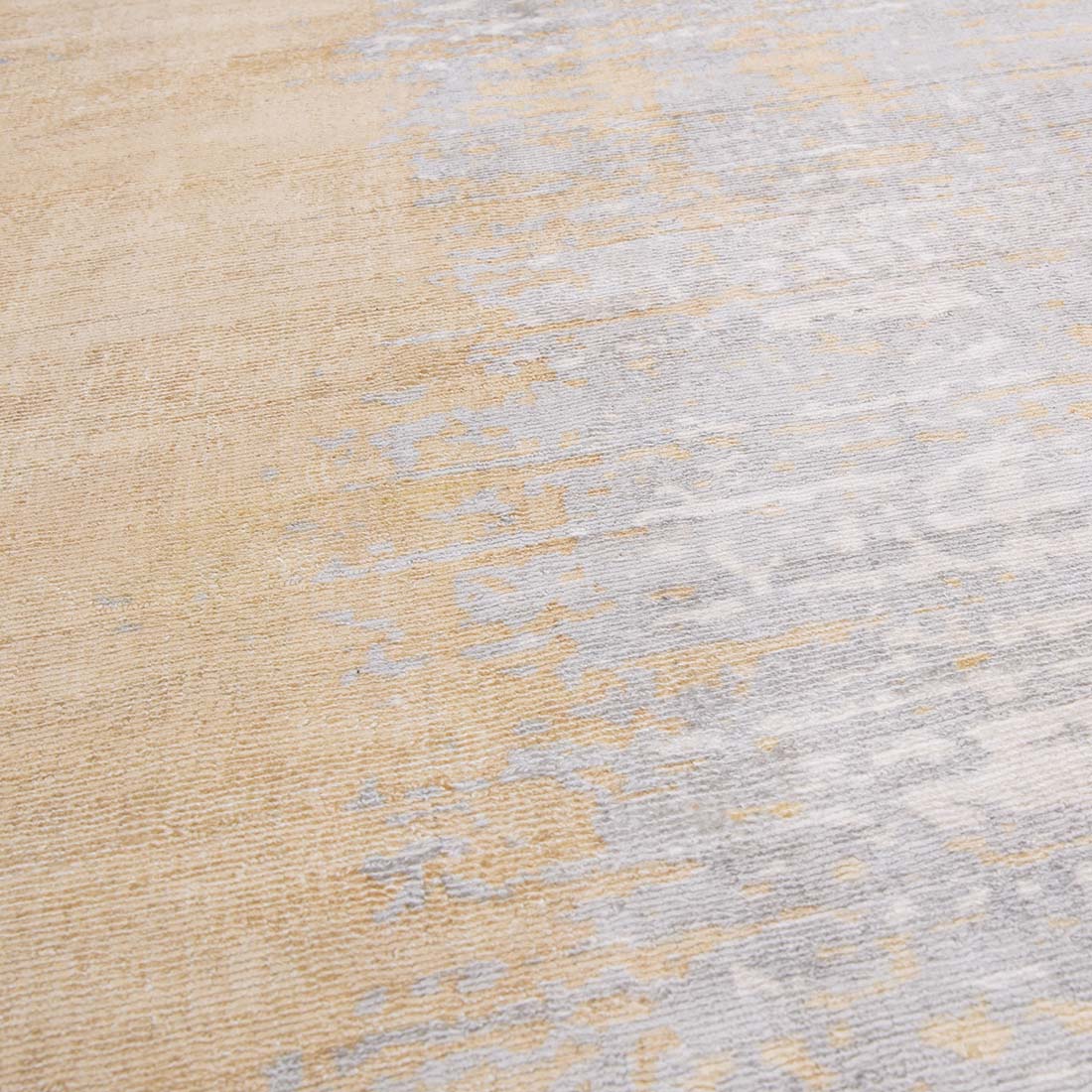 modern gold and beige area rug with abstract design
