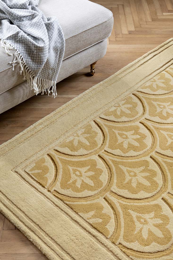 Modern gold wool rug with leaf motif 
