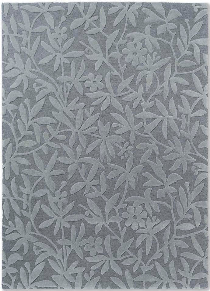 Grey wool rug with hand carved floral motifs
