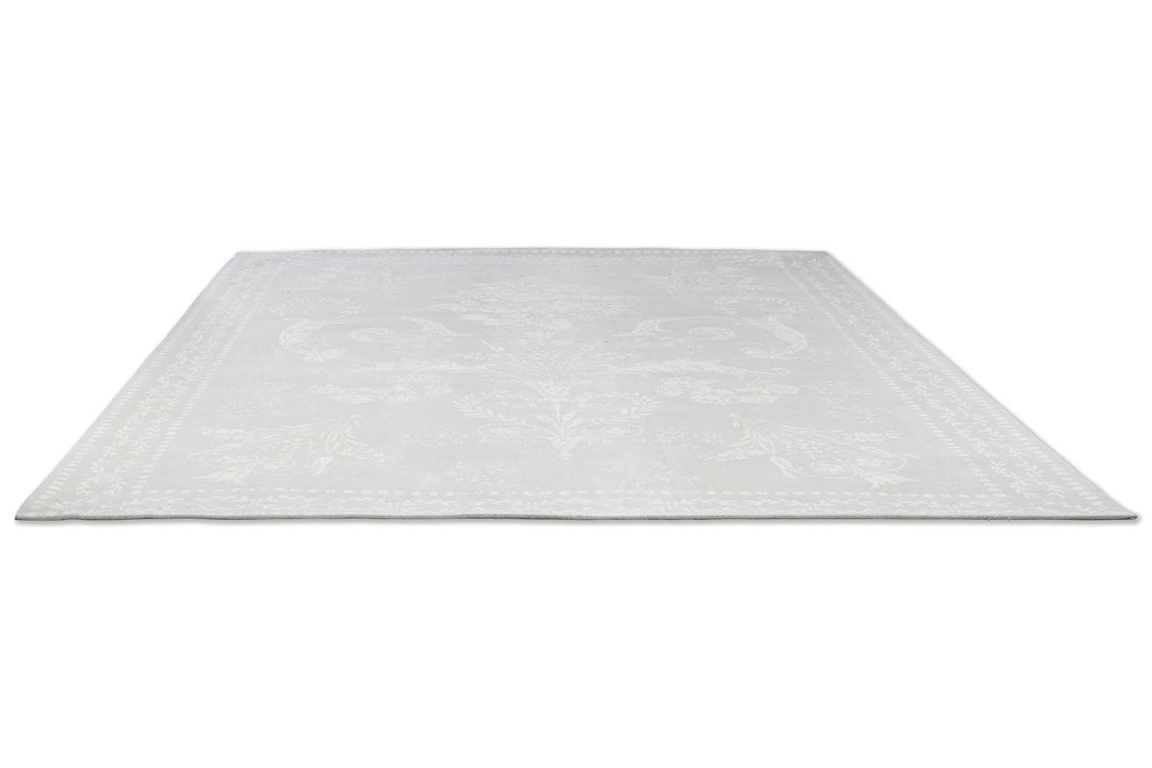 Grey cotton rug in a damask pattern
