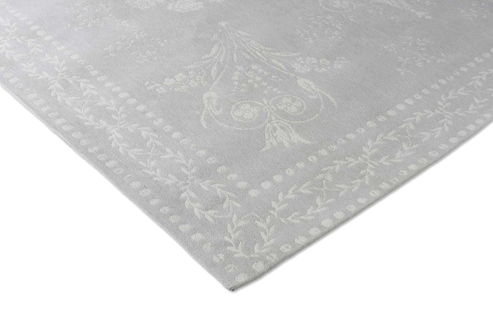 Grey cotton rug in a damask pattern
