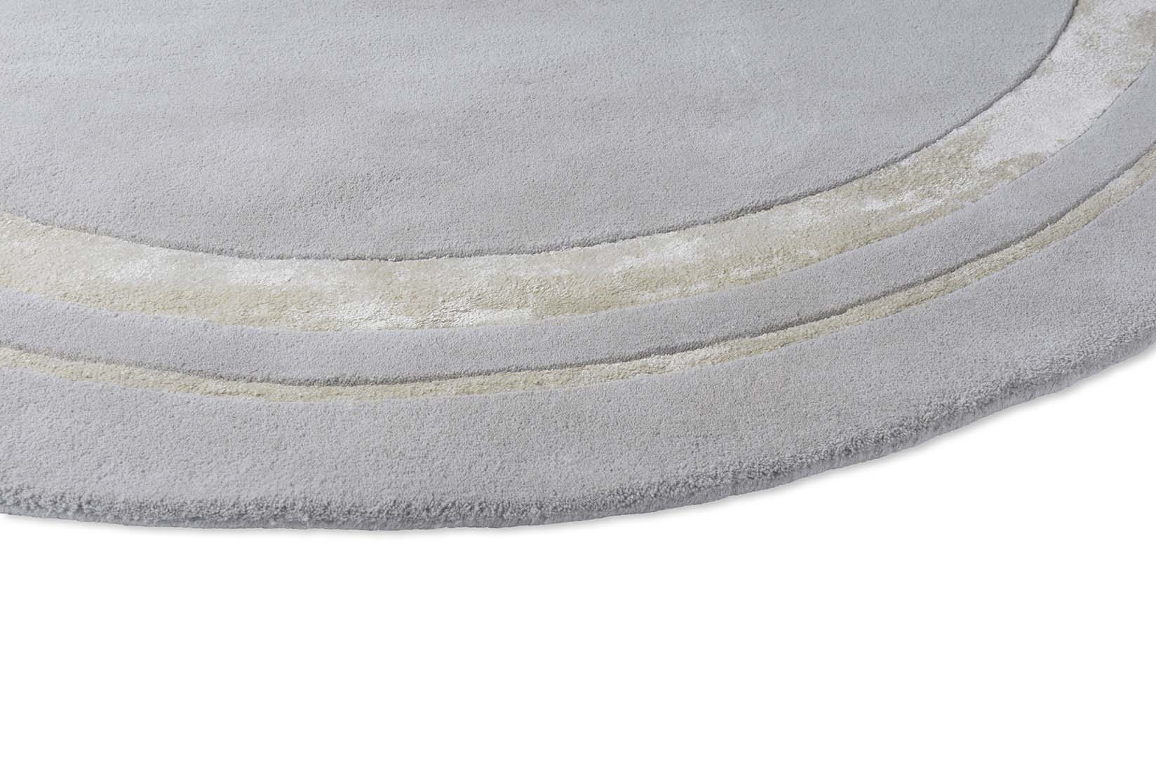 Plain grey and silver wool and viscose circle rug 
