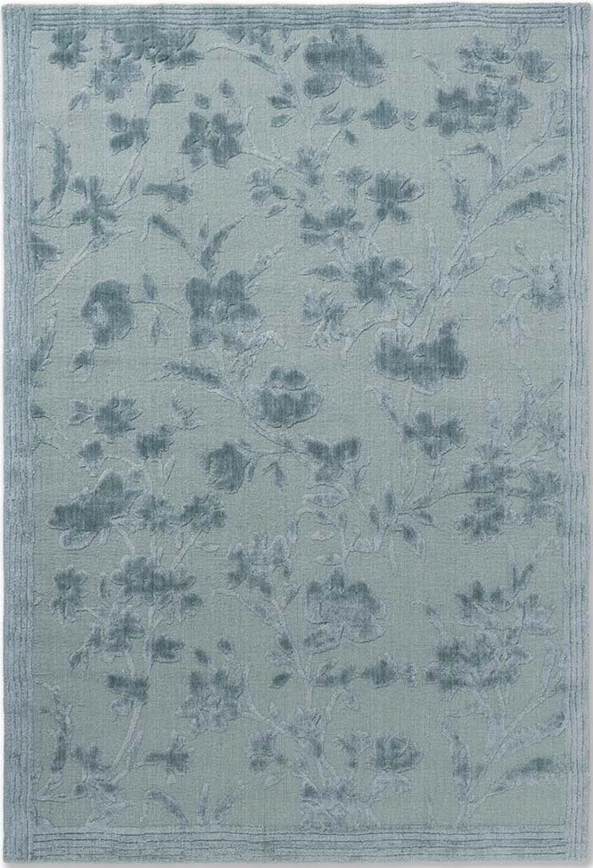 Bamboo silk, cotton and wool rug in blue with floral design.
