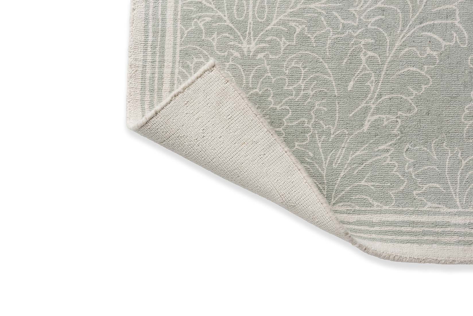 Green cotton rug in damask pattern
