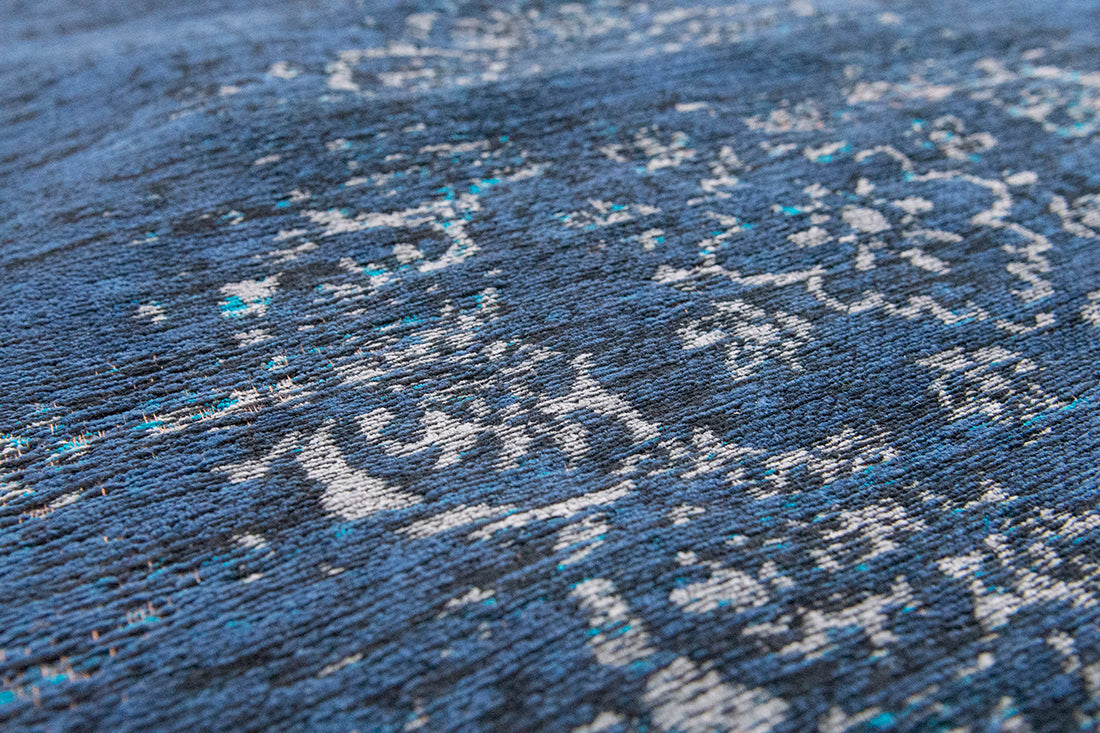 Blue flatweave rug with faded persian design