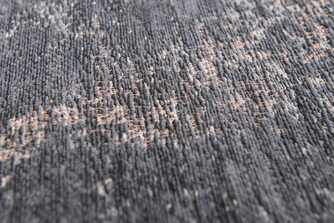 Black flatweave rug with faded persian design
