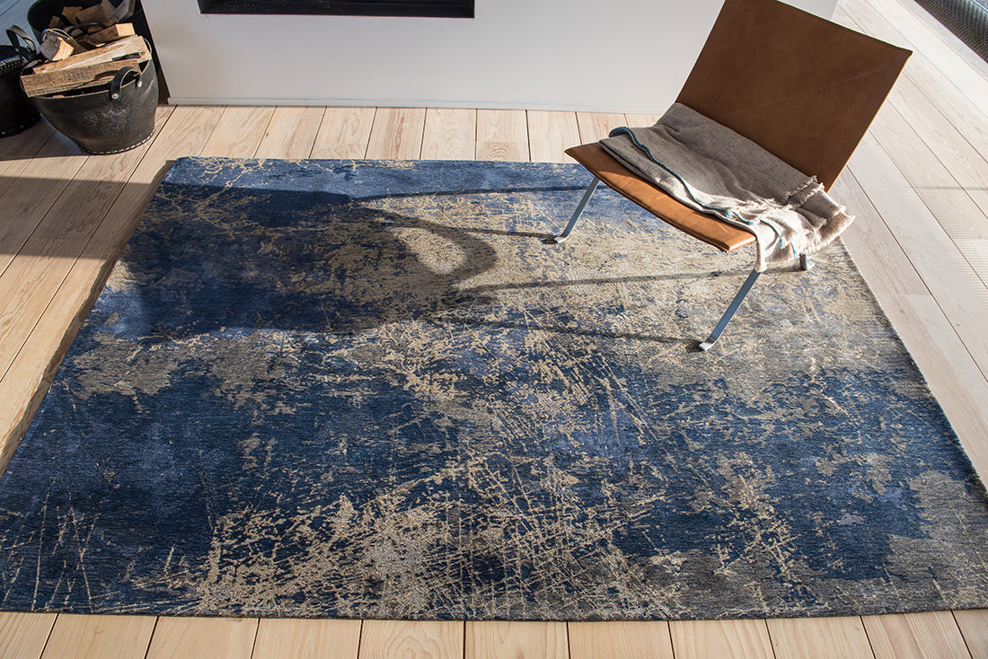 Flatweave rug with faded jagged abstract design in beige and blue