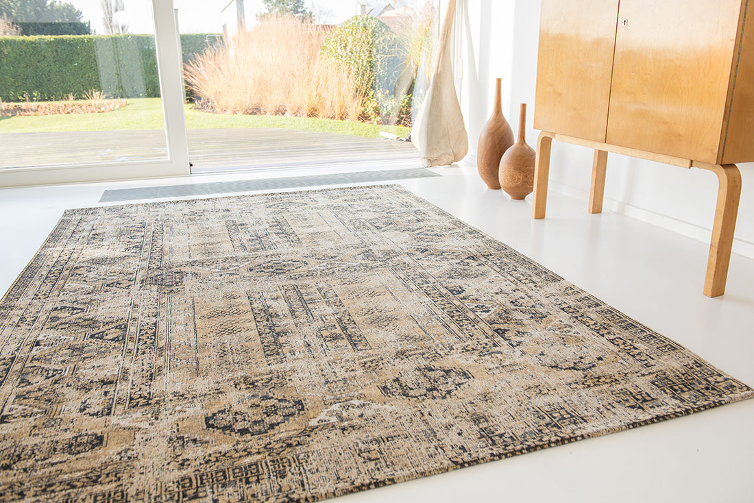 Gold and beige flatweave rug with faded persian design of floral motifs and gul medallions