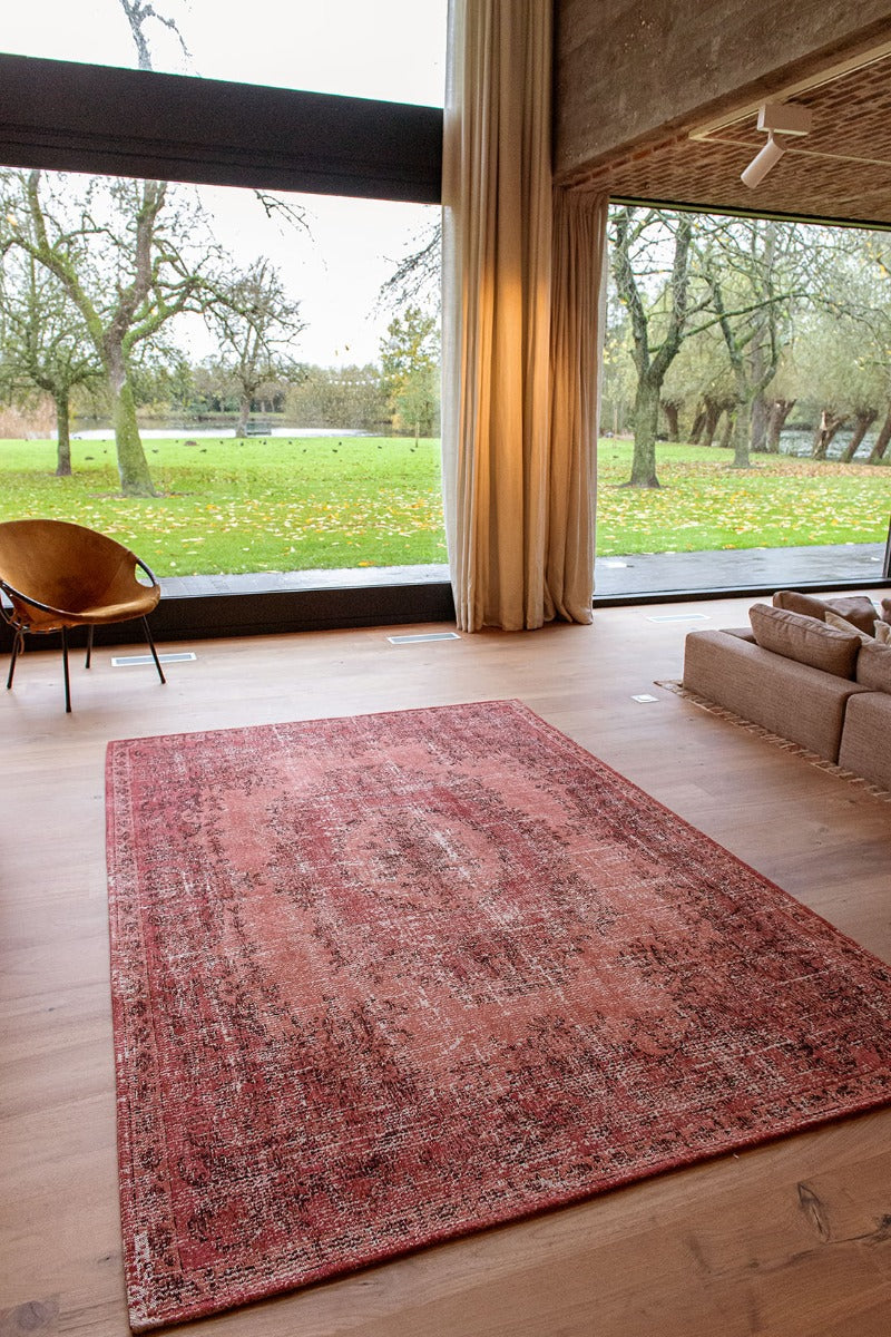 red vintage style rug with a traditional design