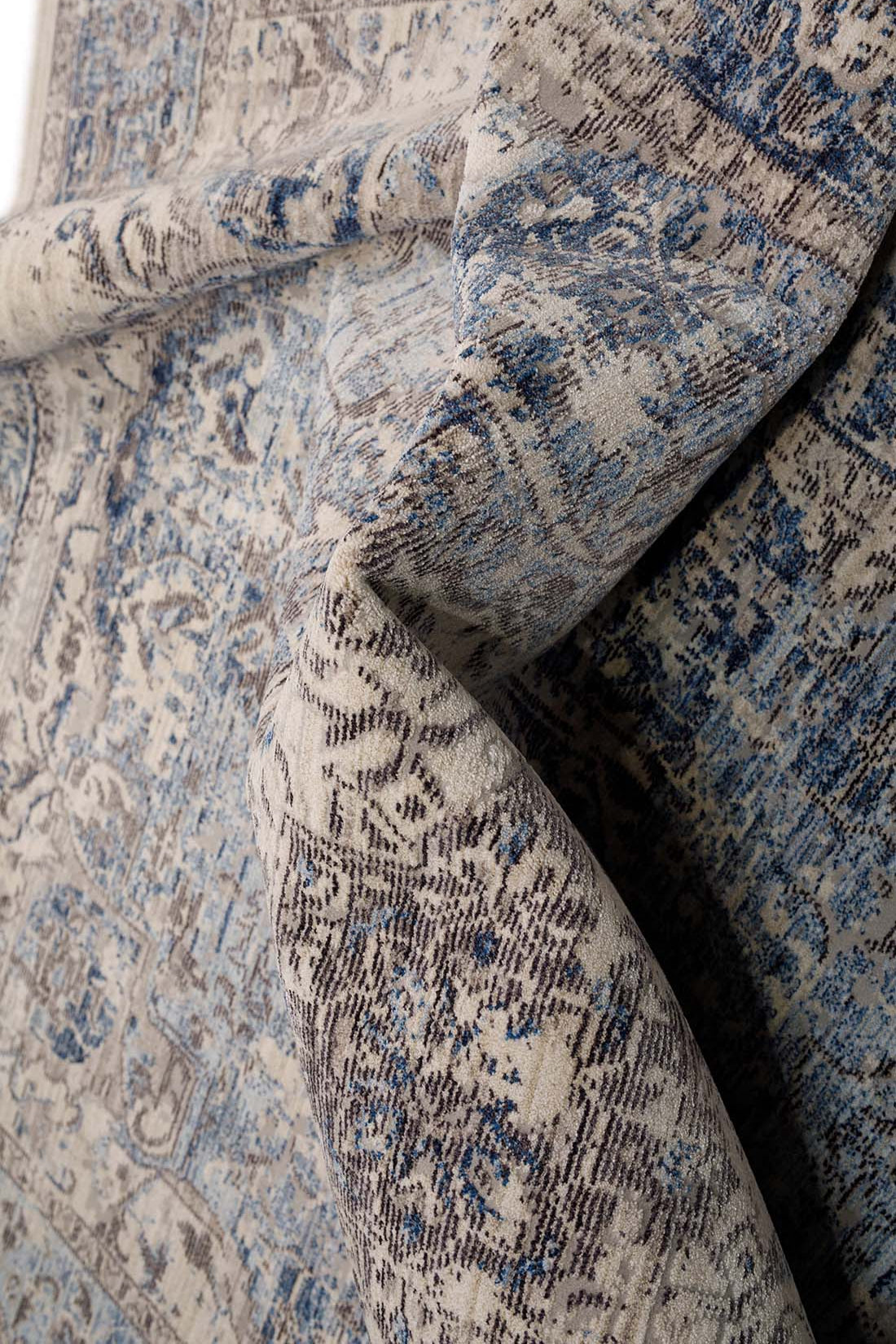 Persian style area rug in blue and grey
