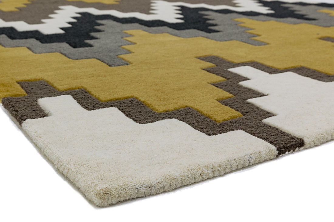 grey and mustard yellow rug with a geometric zig zag design