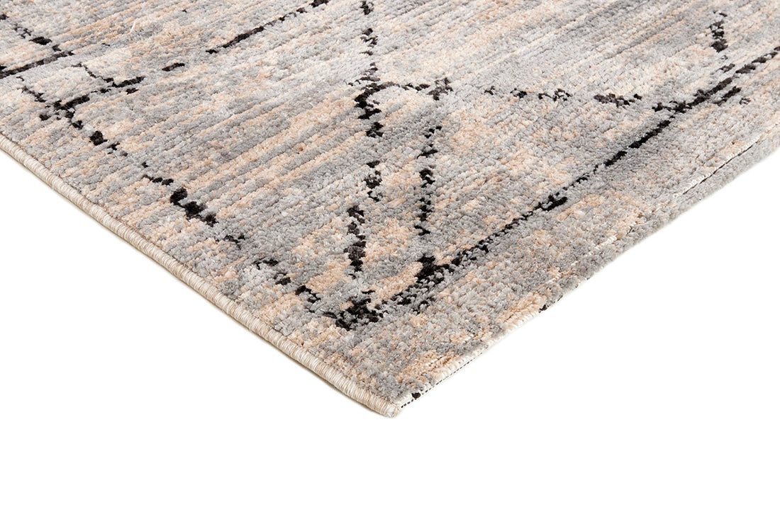 Beige rug with black geometric pattern
