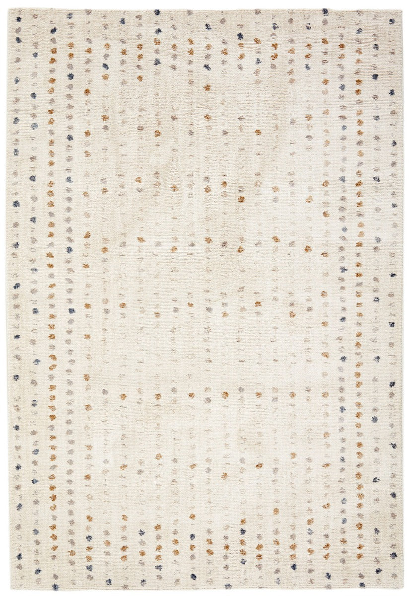 Cream rug with multicoloured geometric polka dot pattern
