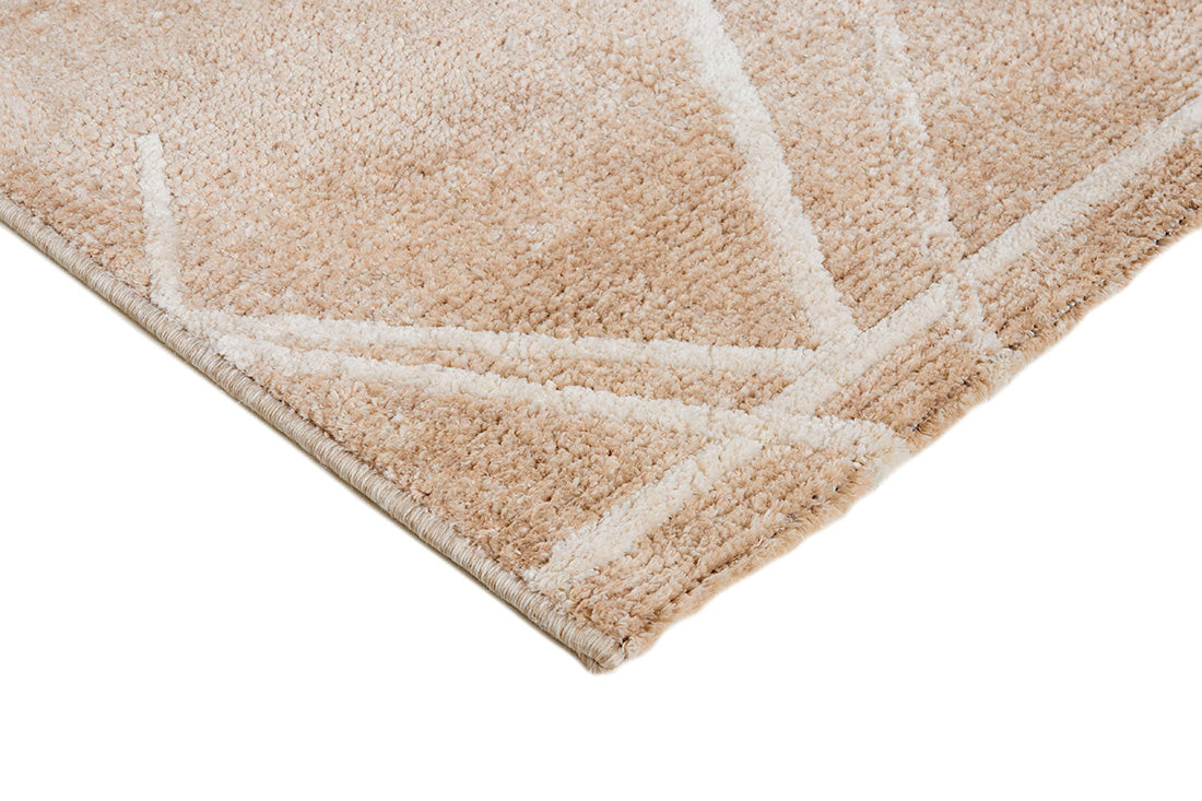 Beige rug with off-white and gold abstract geometric pattern
