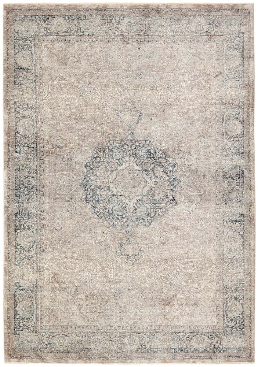Traditional style rug with beige backing and blue patterned border design

