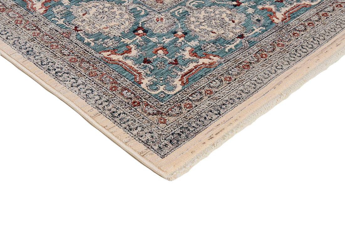 Traditional style rug with cream backing and green patterned border design
