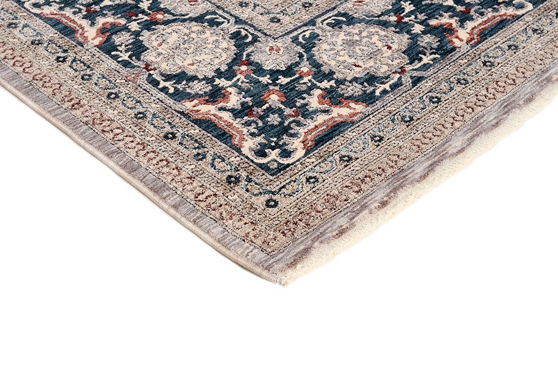 Traditional style rug with grey backing and patterned border design
