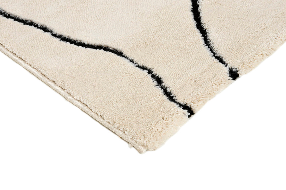 Plain cream Moroccan style rug with minimal abstract pattern
