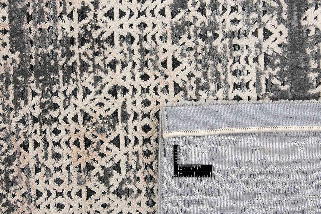 Modern style rug with abstract rectangle pattern in shades of grey
