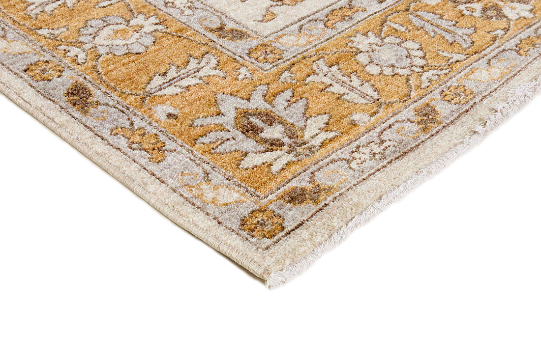 Traditional gold Ziegler-style rug with floral motif 
