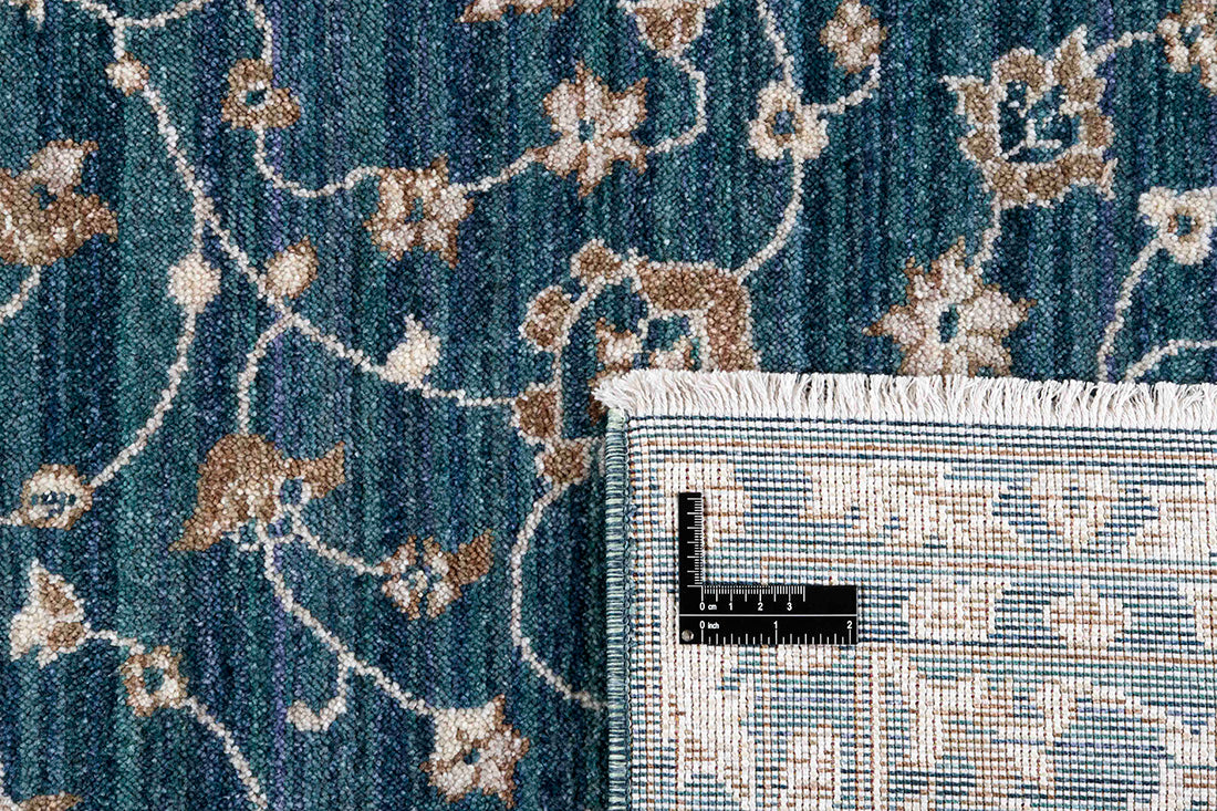 Traditional blue Ziegler-style rug with floral motif 
