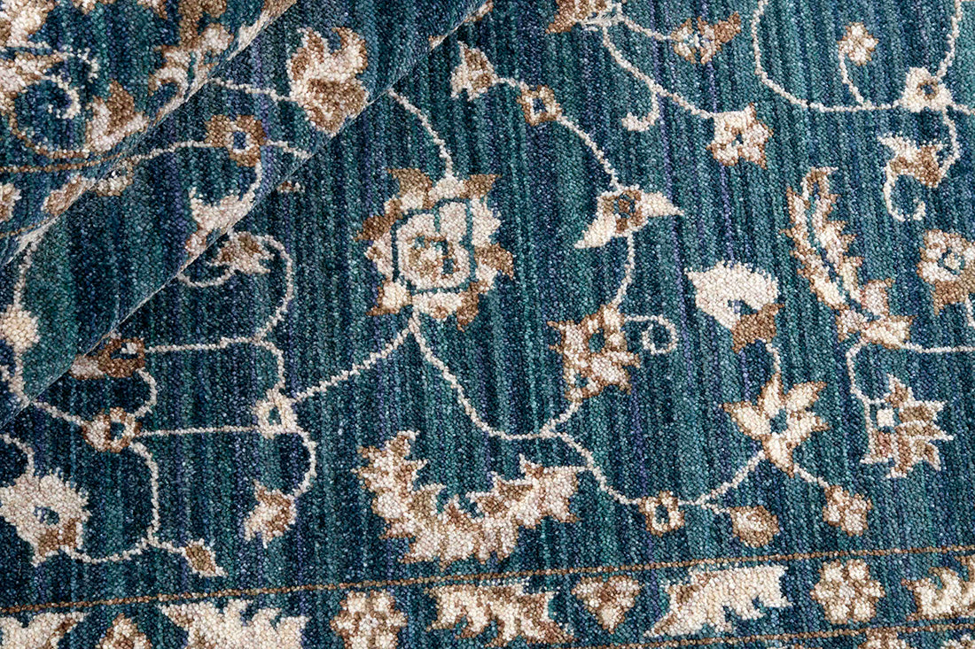 Traditional blue Ziegler-style rug with floral motif 
