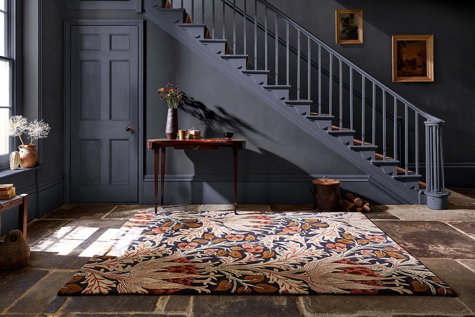 charcoal and rust wool rug with floral print
