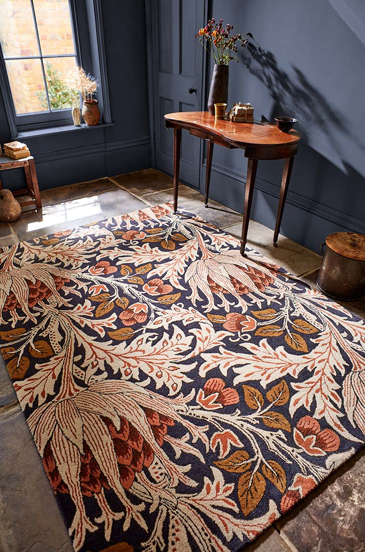 charcoal and orange wool rug with floral print
