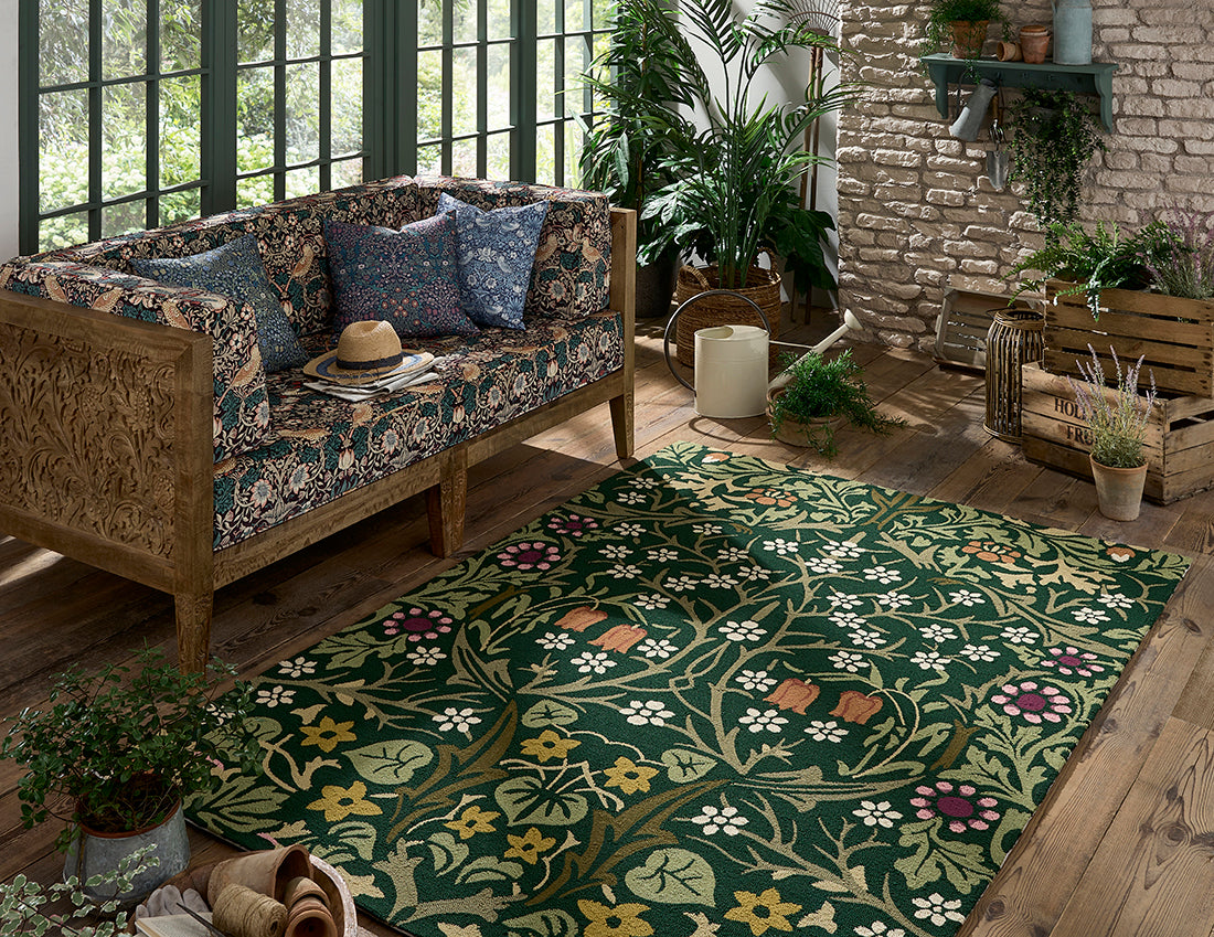 green indoor/outdoor rug with floral pattern
