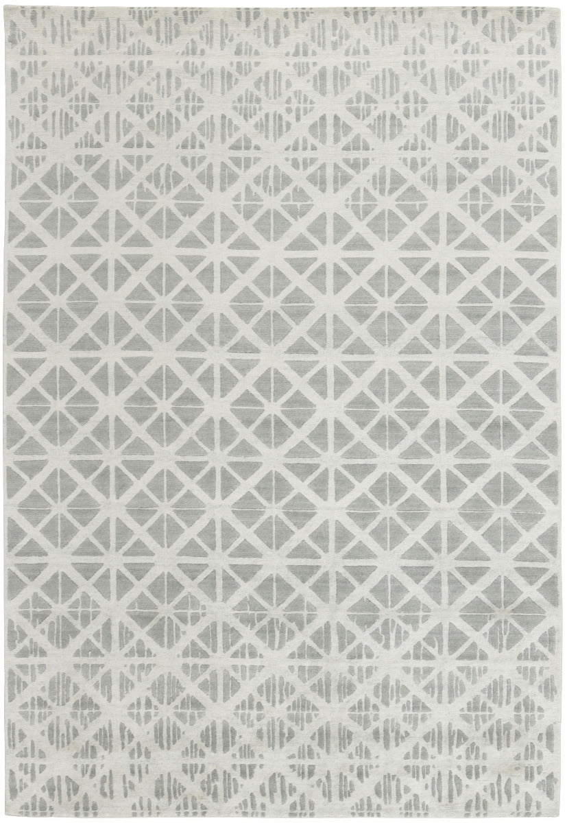 large area rug with a geometric design in grey