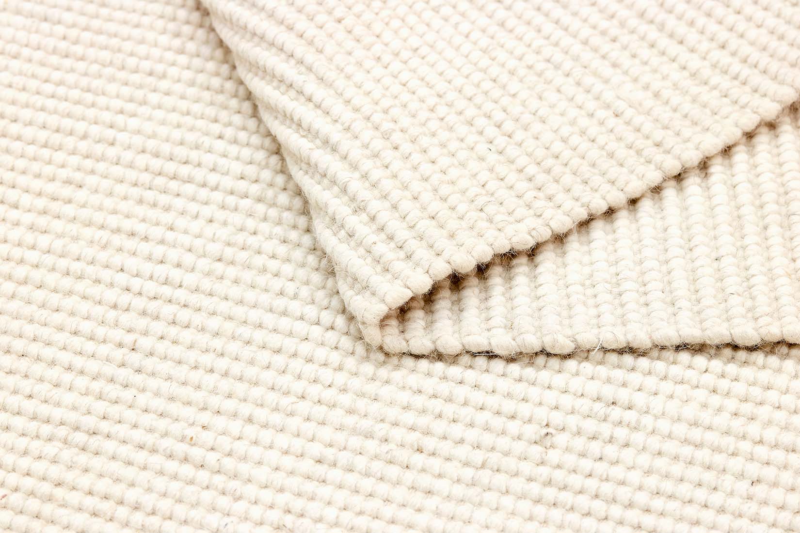 Simple white textured flatweave rug
