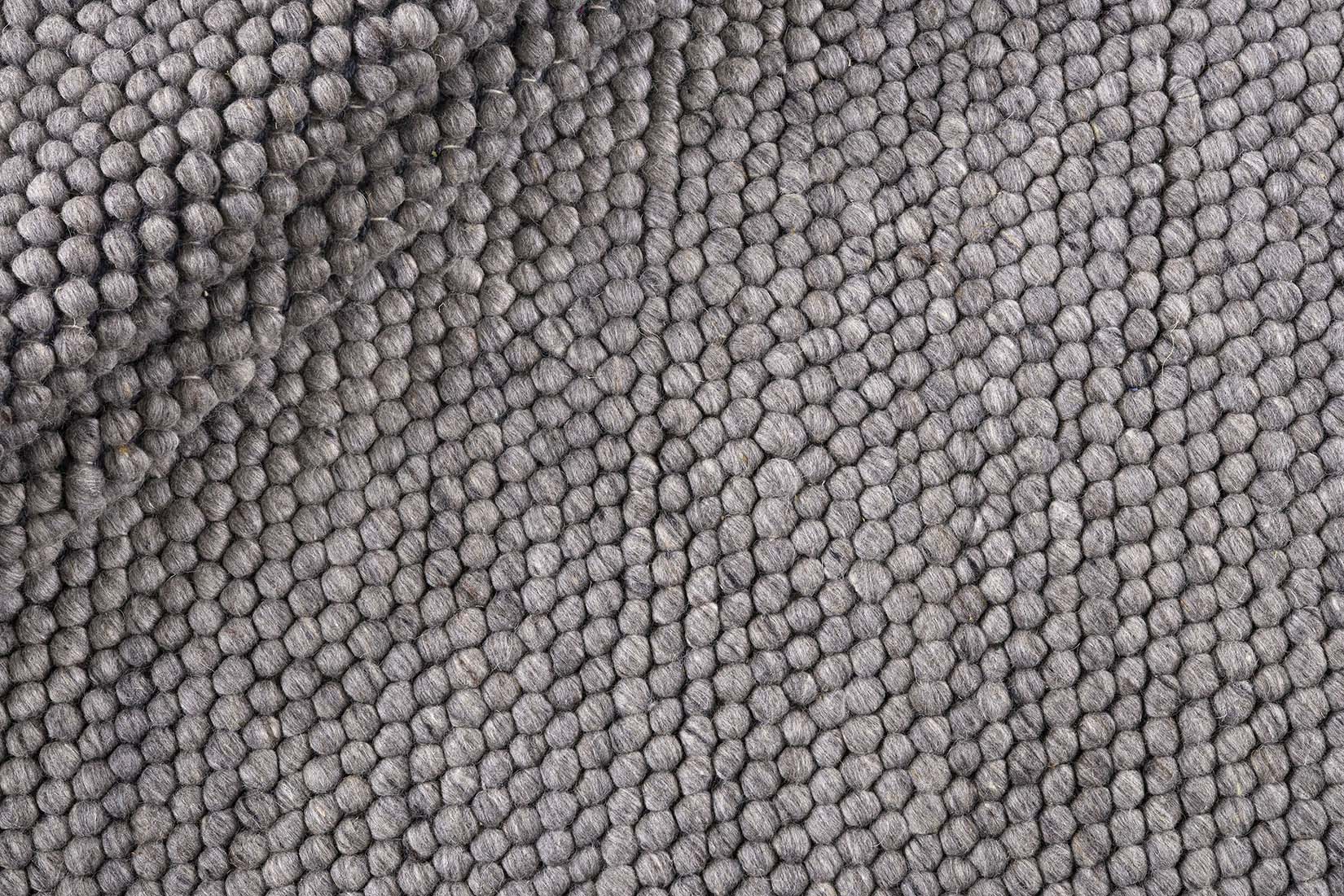 dark grey textured wool rug
