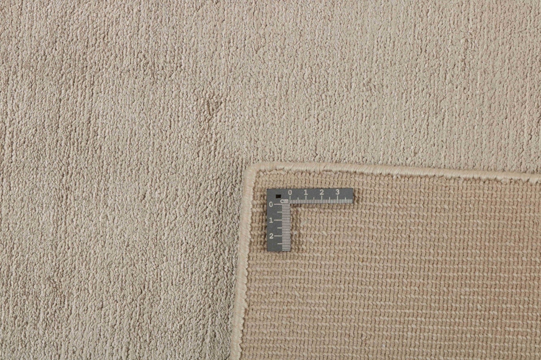 large plain beige rug
