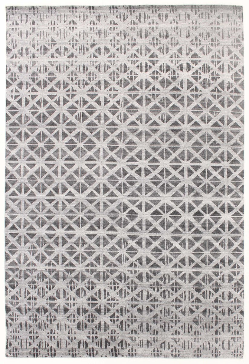 large area rug with a geometric design in grey and black