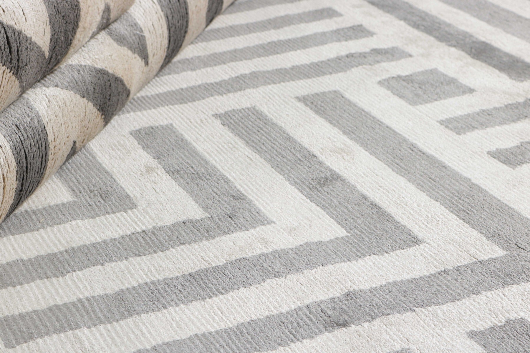 geometric area rug in grey and white