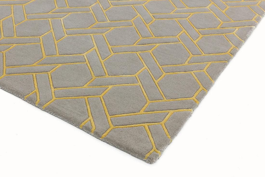 yellow and grey rug with a geometric pattern