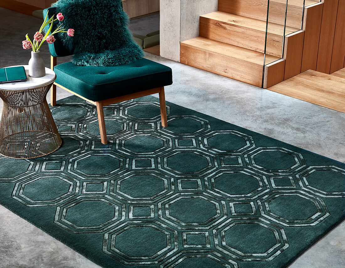 green rug with a geometric pattern