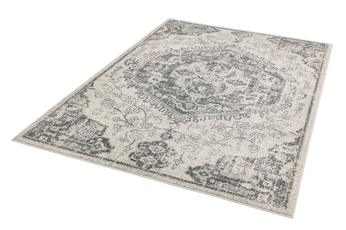 grey rug with an oriental pattern 