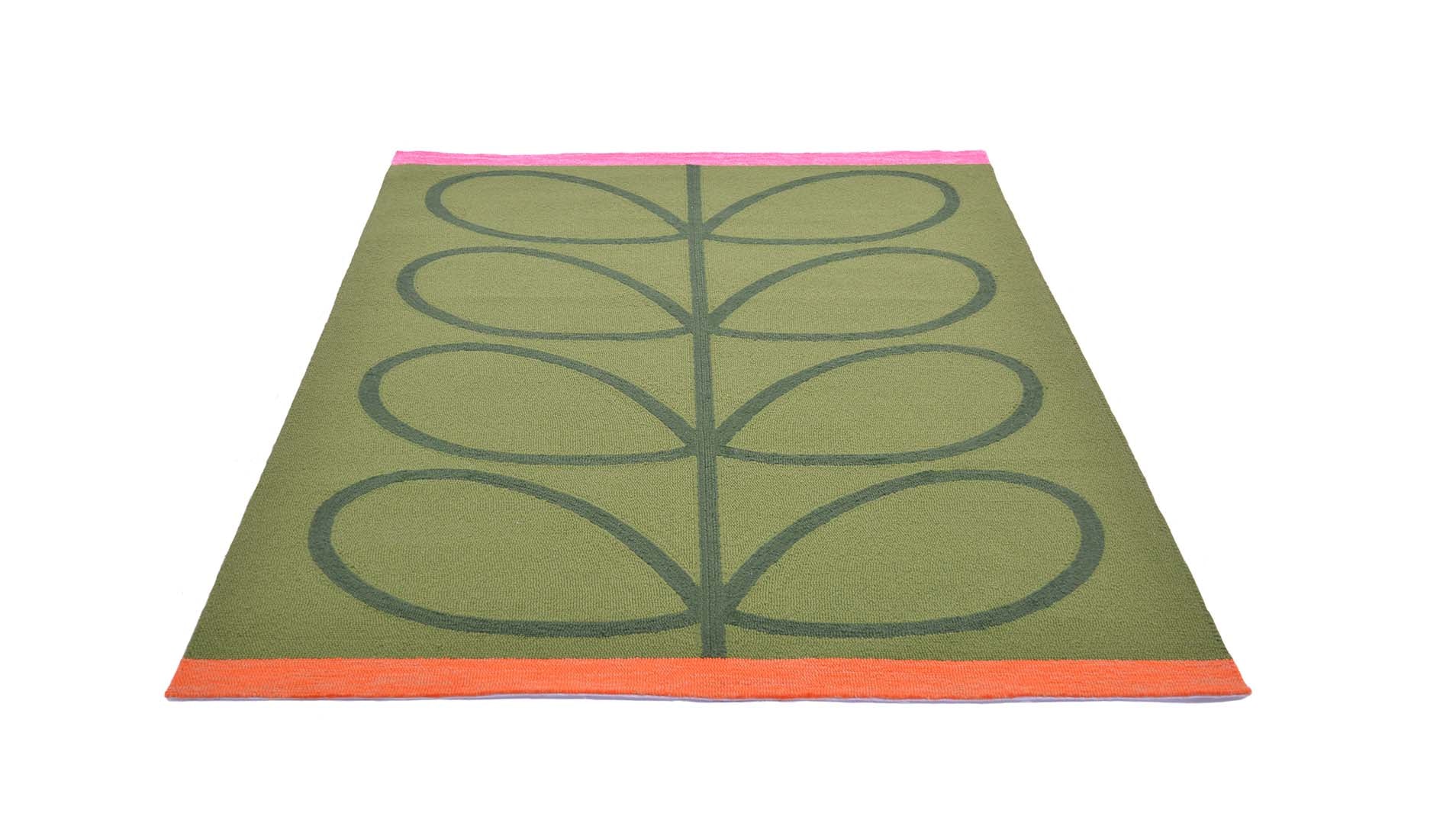 green indoor/outdoor rug with oversized floral print
