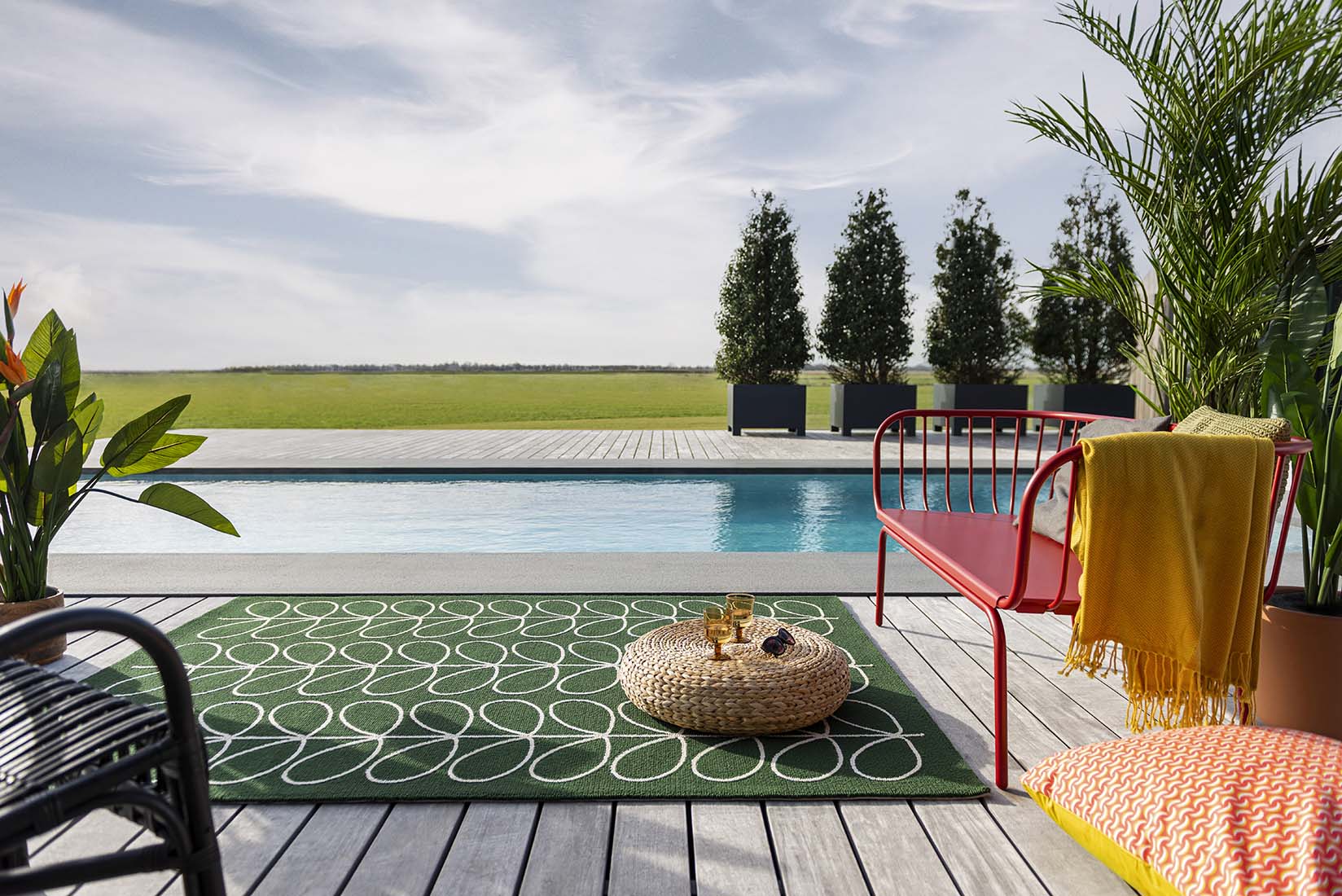 green indoor/outdoor rug with allover floral print
