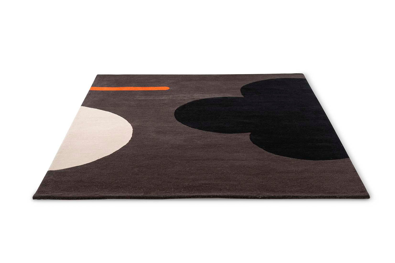 grey and black wool rug with retro floral design
