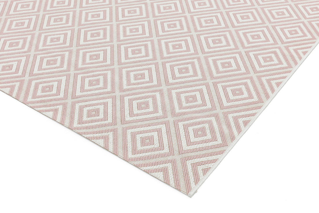 pink and white geometric rug for indoors and outdoors